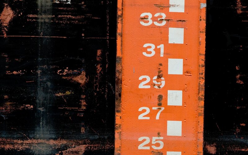 orange measurement scale on black surface