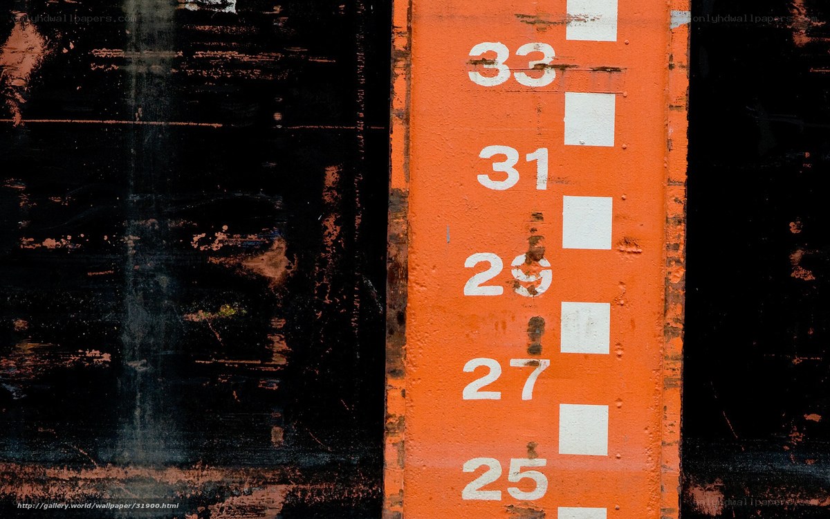 Orange measurement scale on wall