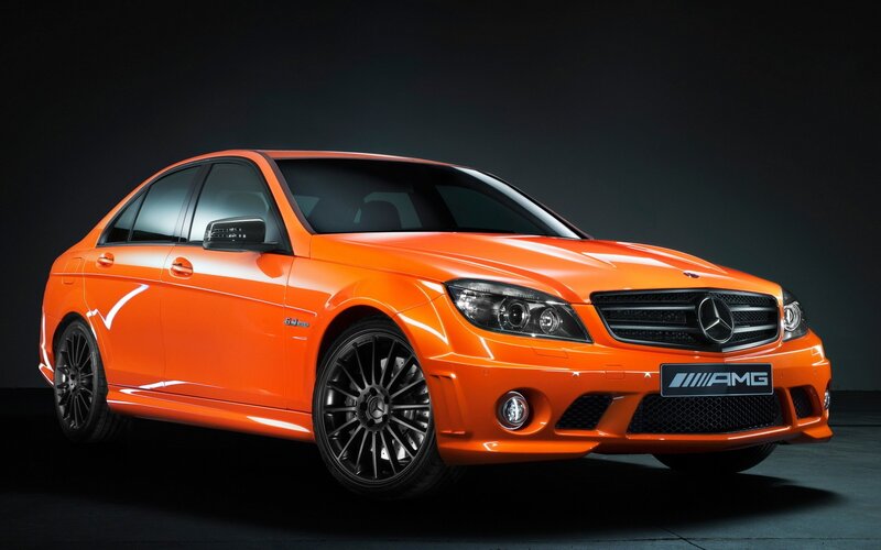 orange mercedes-amg sedan