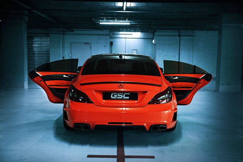 Orange Mercedes-Benz with doors open