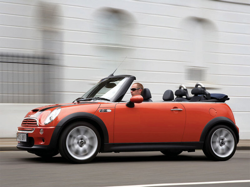 Orange MINI convertible in motion