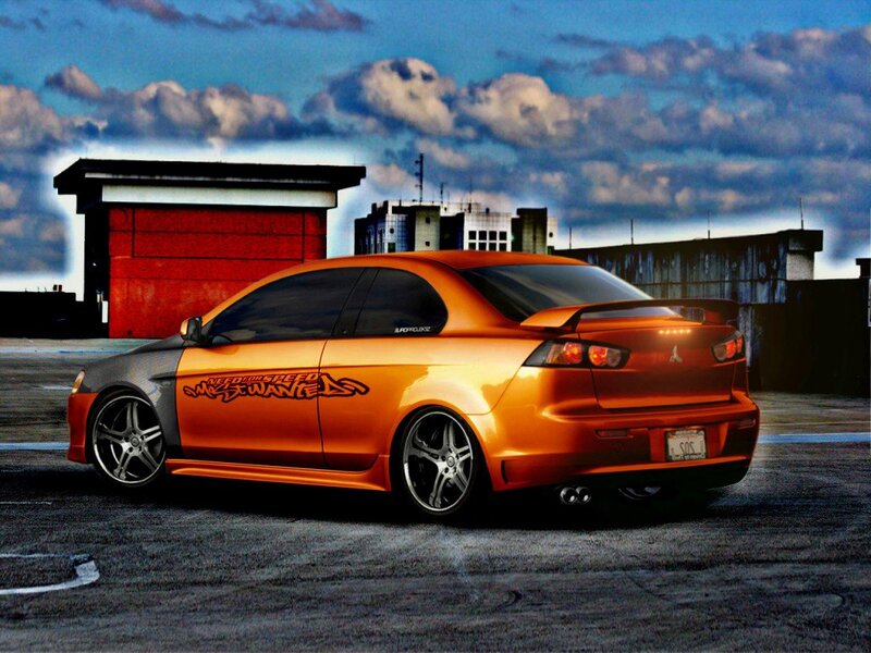 Orange Mitsubishi Lancer — Dramatic, Sunset