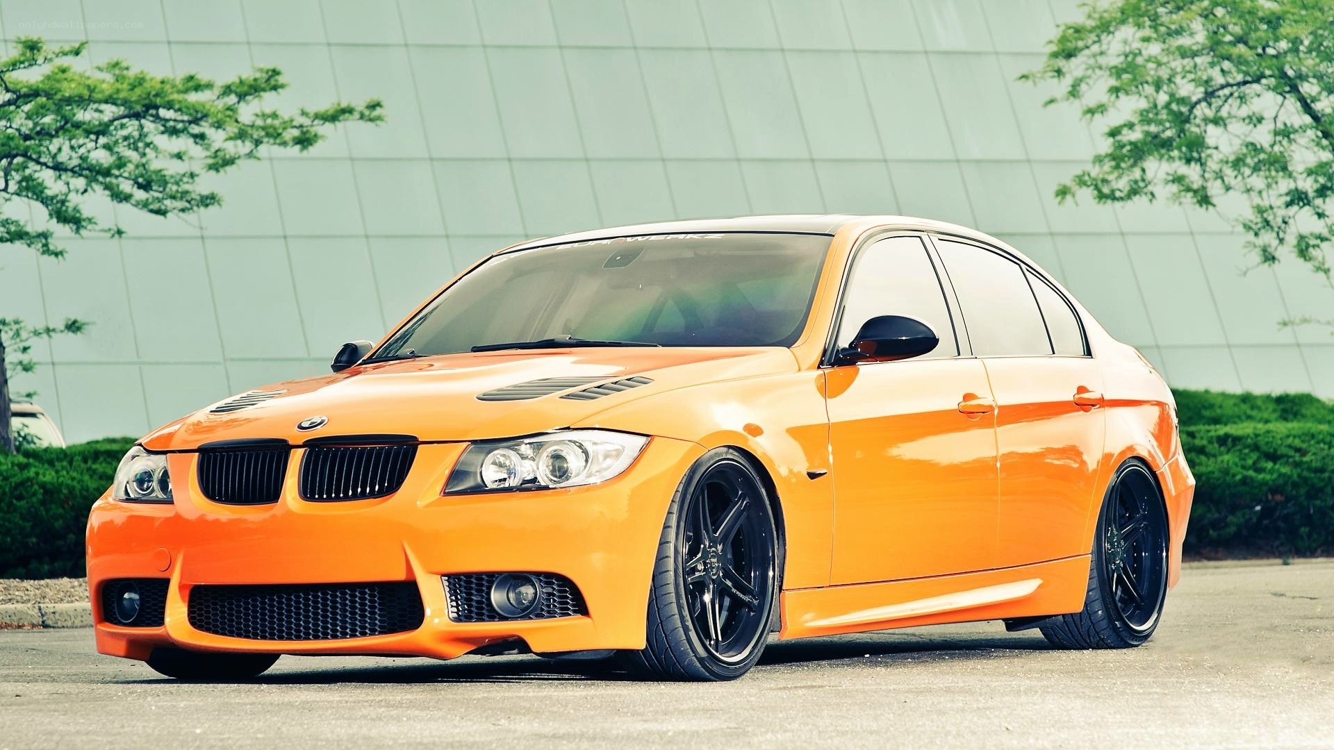 orange modified BMW sedan