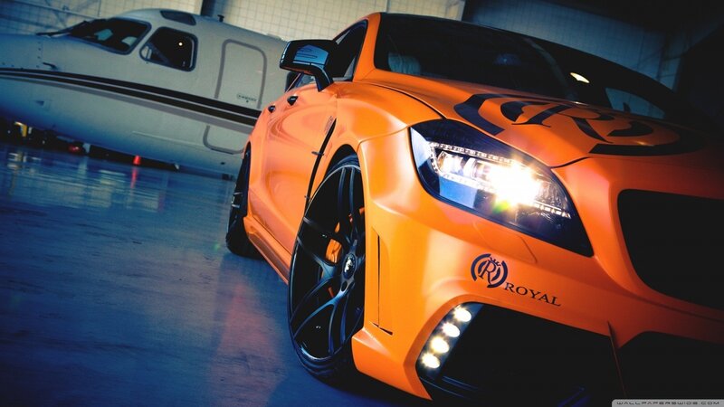 Orange Modified Car — Dramatic, Photograph, Airplane, Hangar, Black, White