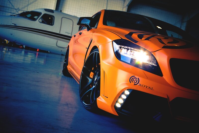 Orange Modified Car — Dramatic, Photograph, Airplane, Hangar, Headlights