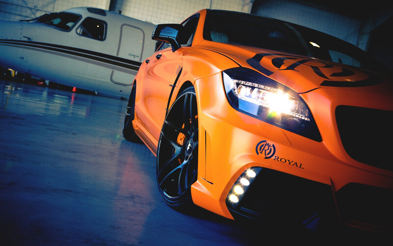 Orange Modified Car — Dramatic, Photograph, Airplane, Hangar