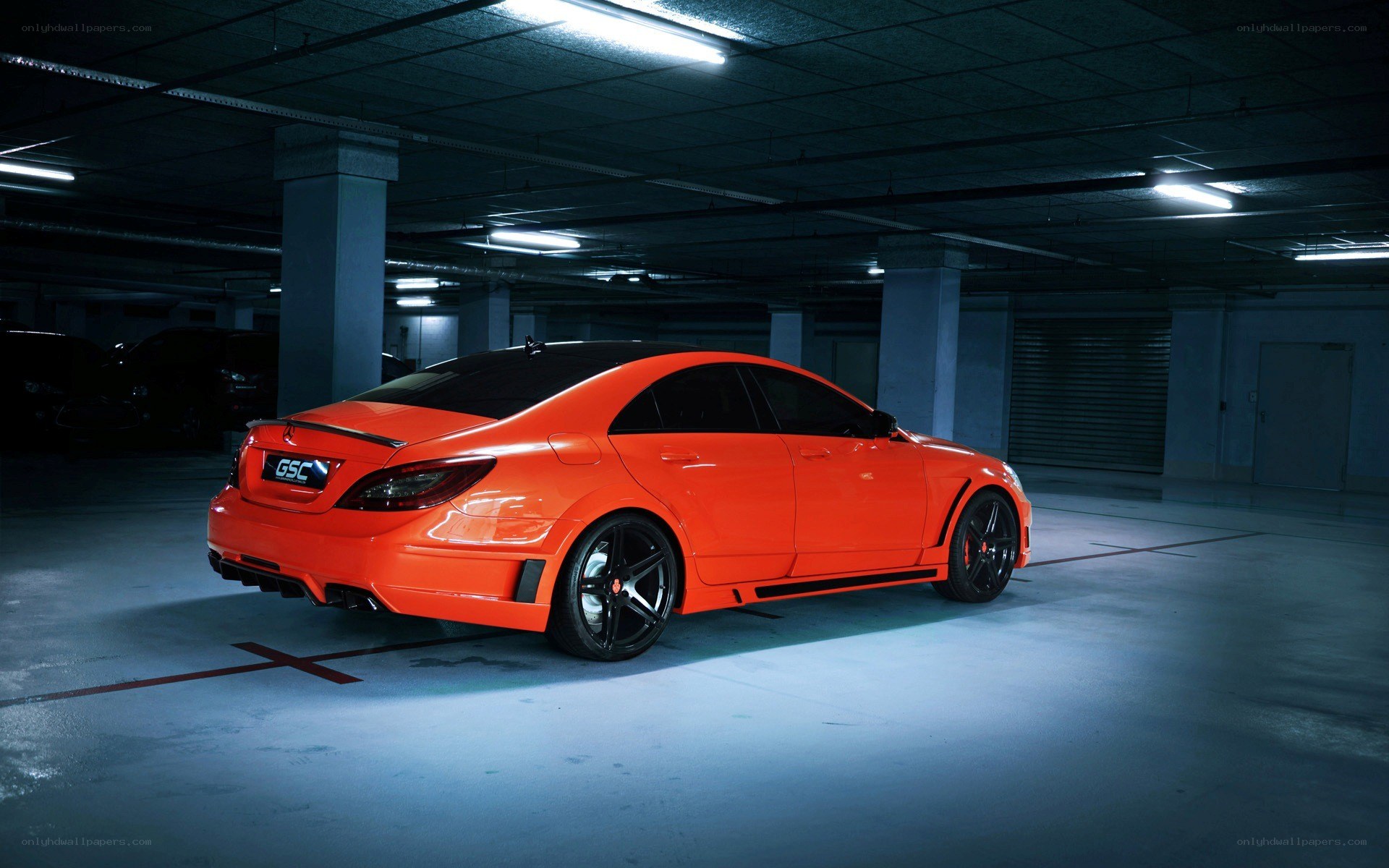 Orange modified car in garage