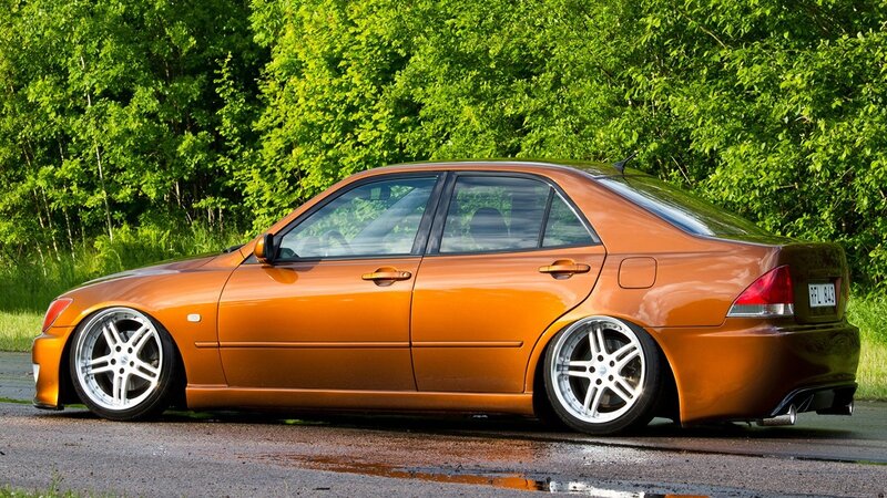 Orange Modified Sedan — Calm, Afternoon, Photograph