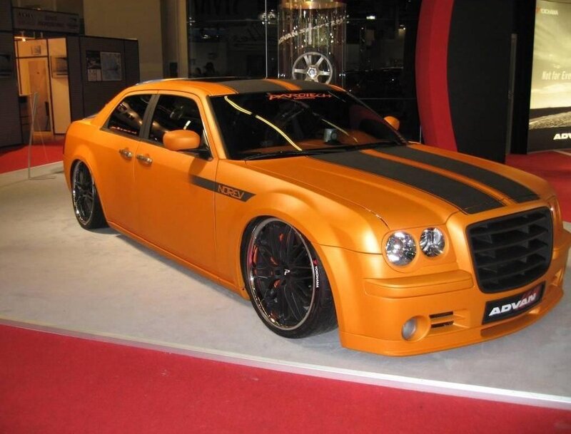 Orange modified sedan on display