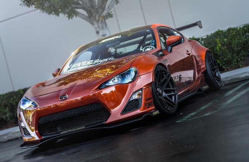 Orange Modified Sports Car — Dramatic, Afternoon, Photograph, Tree, Bushes, Parking Lot