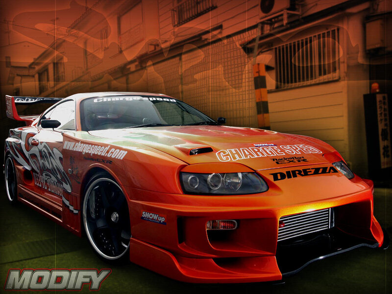 Orange Modified Sports Car — Dramatic, Night, Photograph, Building