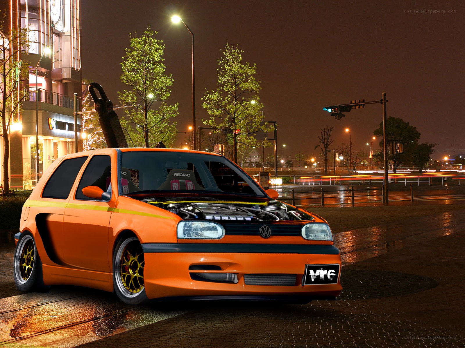 Orange modified Volkswagen at night