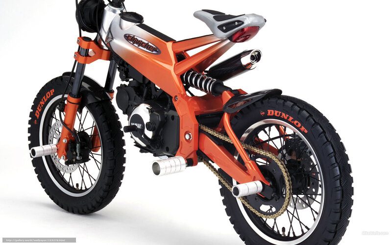 orange motorbike with Dunlop tires