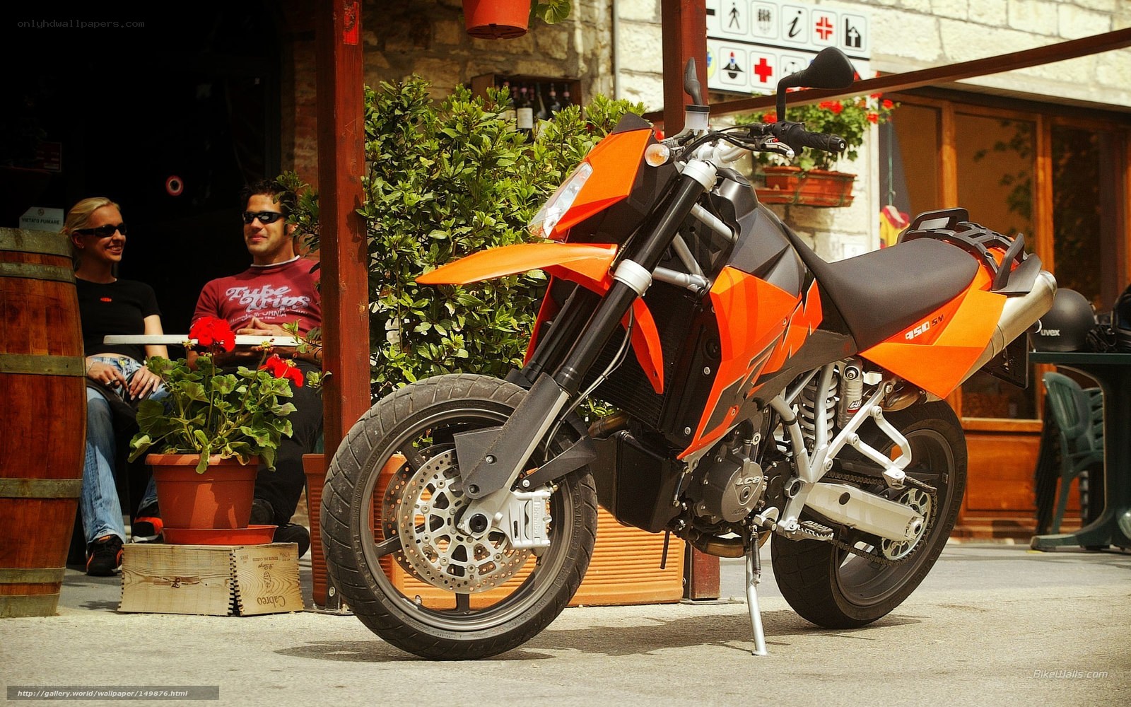 Orange motorcycle at outdoor cafe