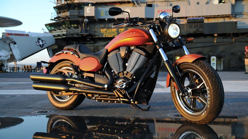 Orange Motorcycle on Deck — Dramatic