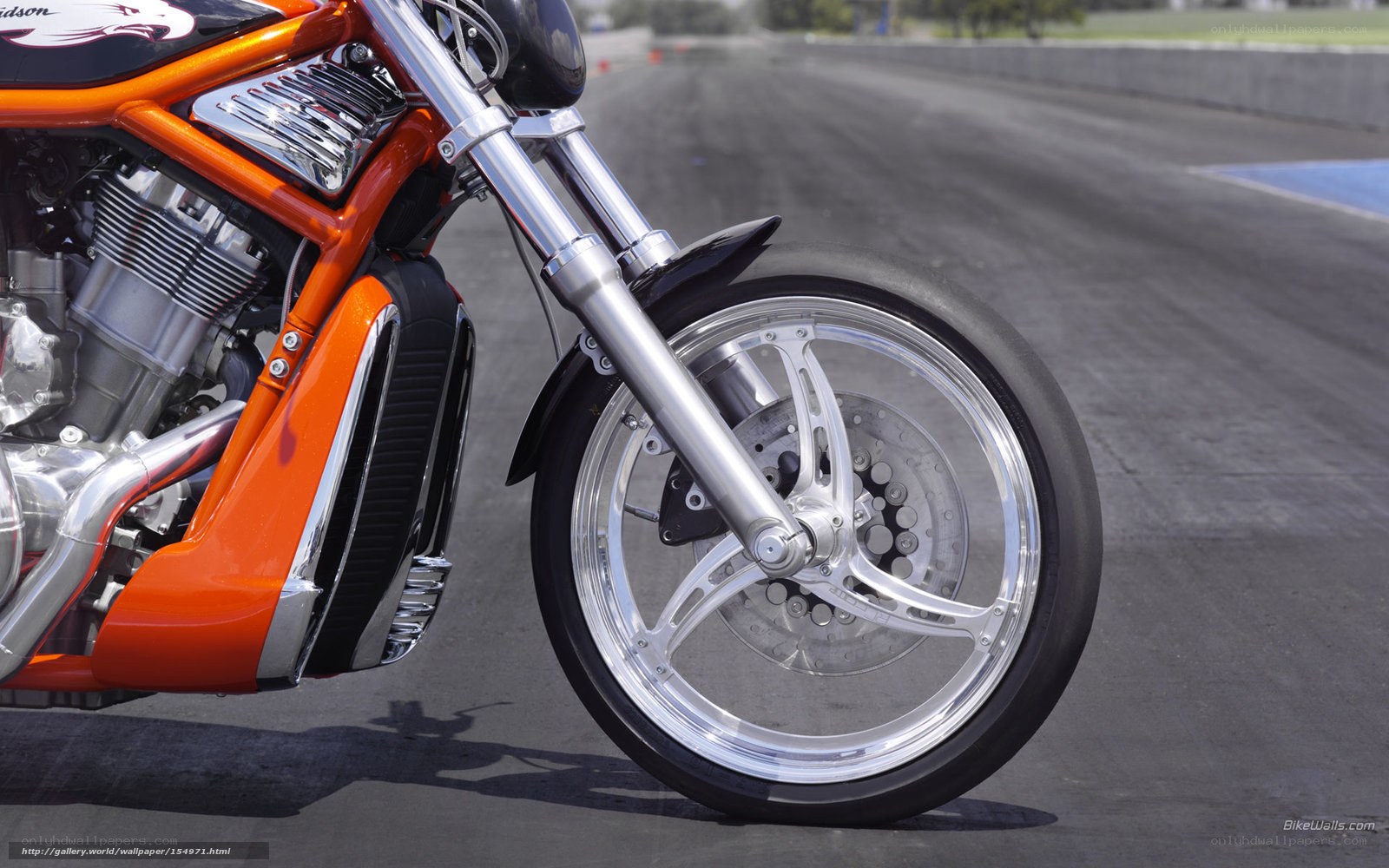 orange motorcycle on racetrack
