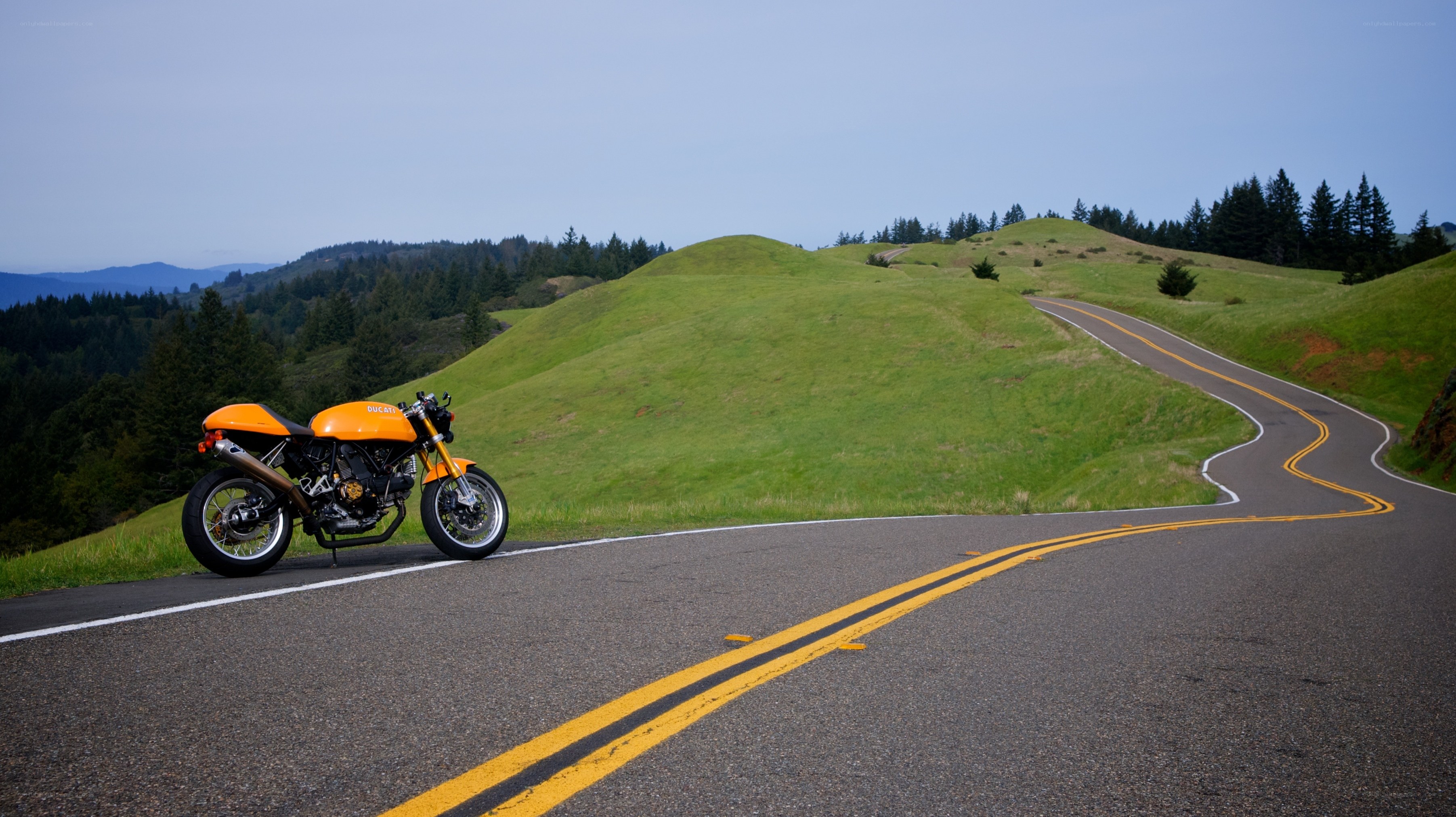 Orange motorcycle on winding road