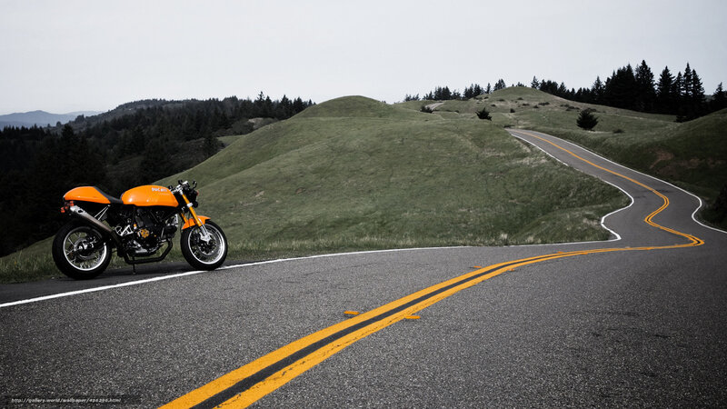 Orange motorcycle on winding road