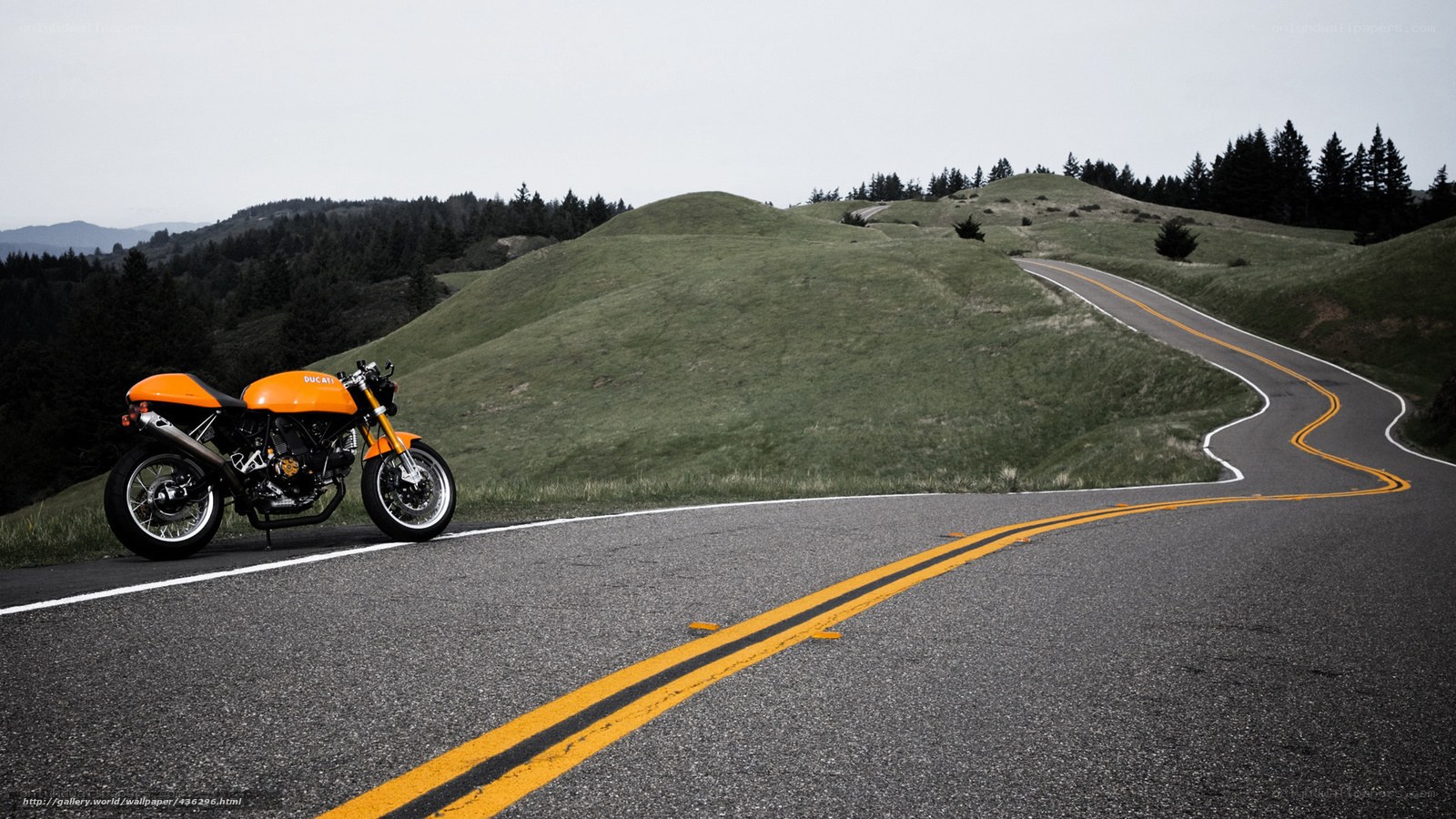 Orange motorcycle on winding road