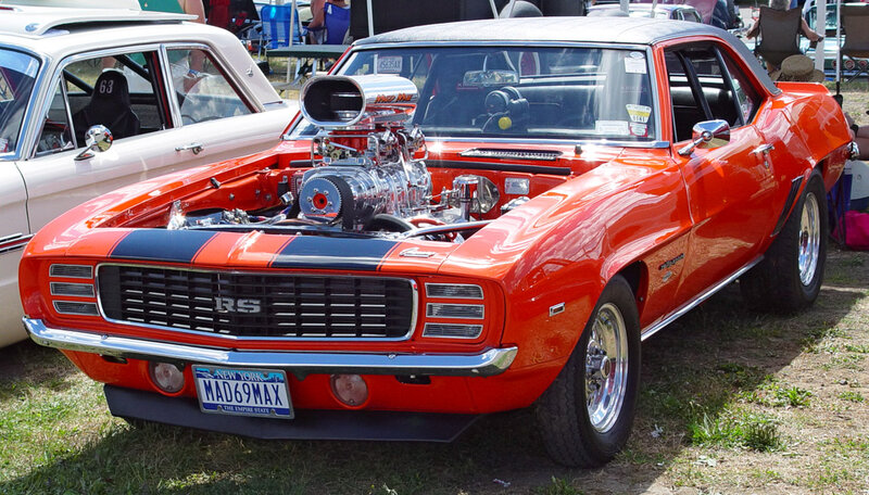 Orange muscle car at a show