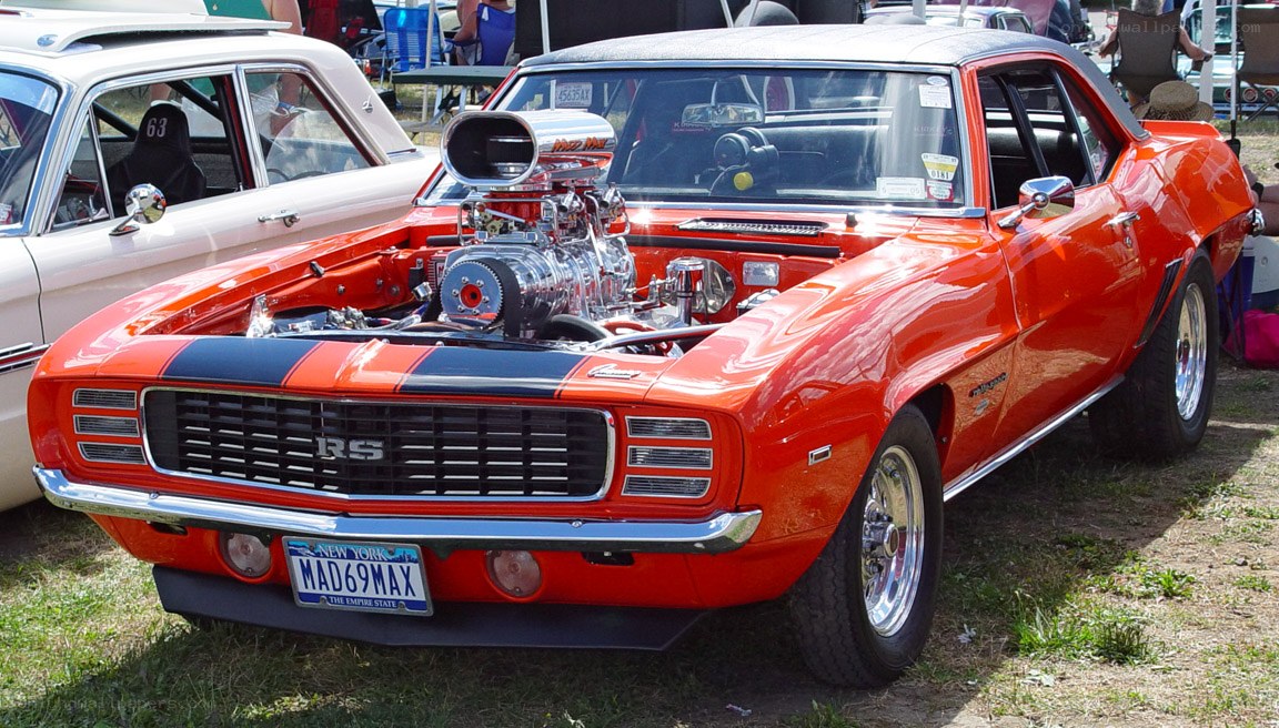 Orange muscle car at a show