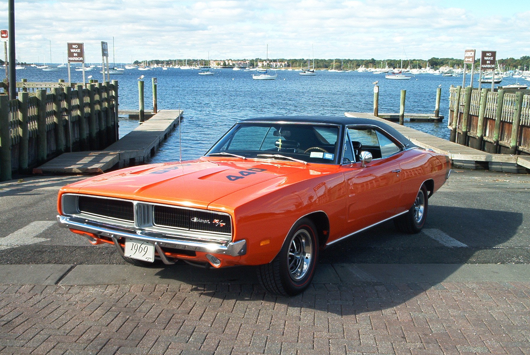 Orange muscle car at harbor