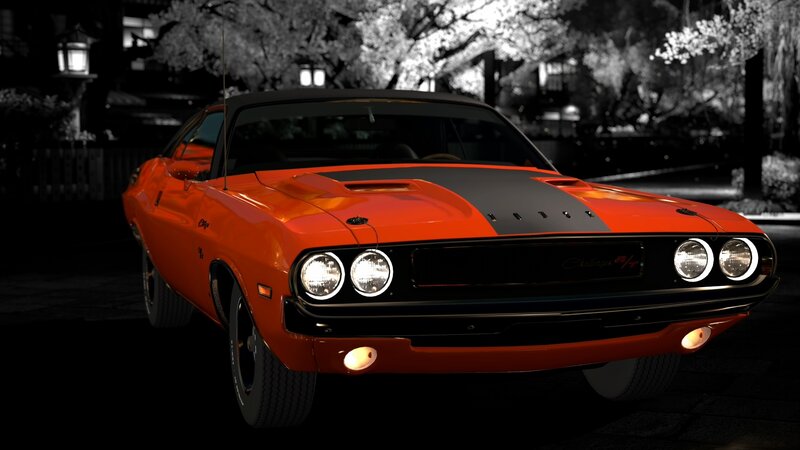 Orange muscle car at night
