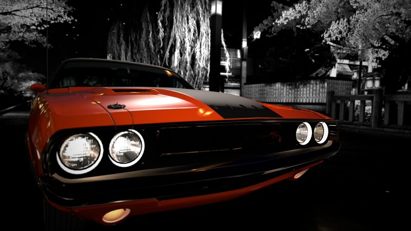 Orange muscle car at night