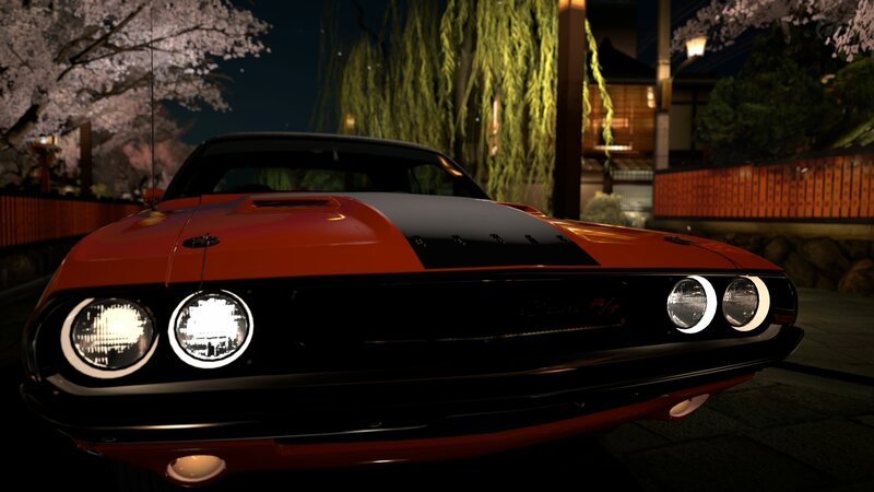 Orange muscle car at night