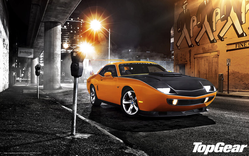 Orange muscle car at night