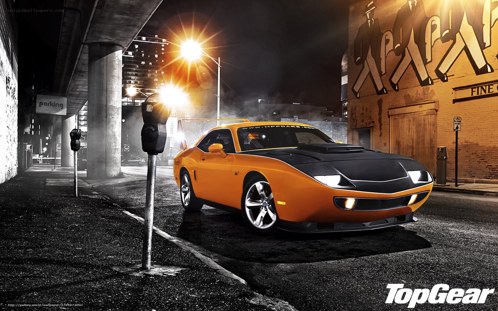 Orange muscle car at night