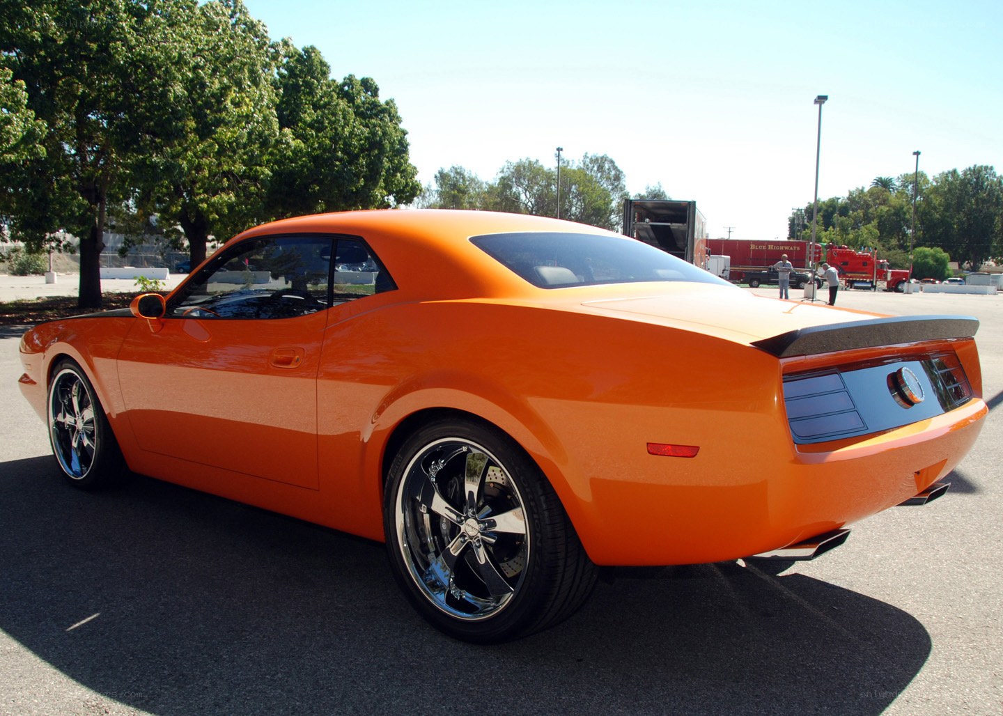 orange muscle car at outdoor event