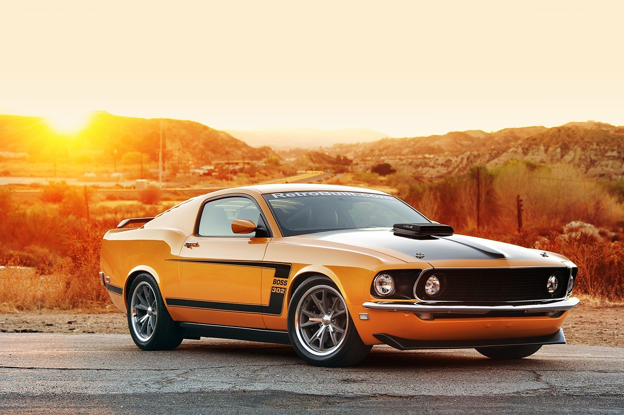 Orange muscle car at sunset