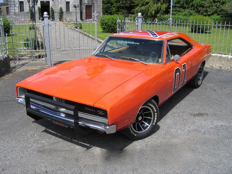 Orange Muscle Car — Bright, Afternoon, Photograph, Fence