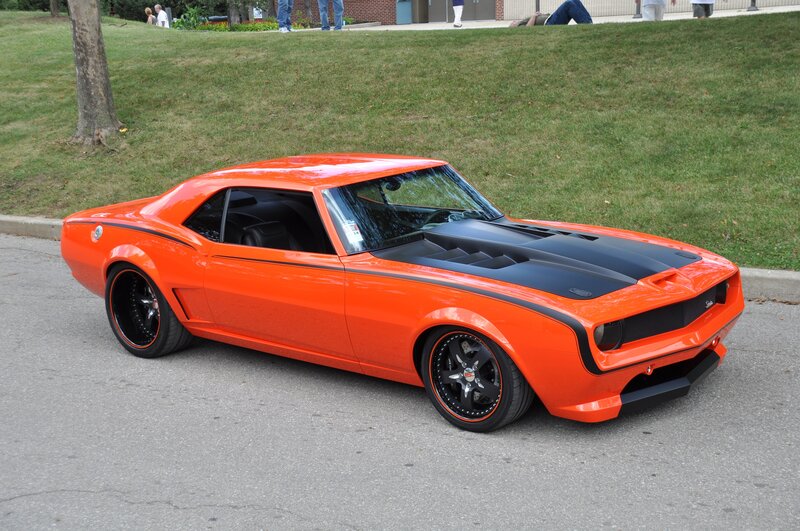 Orange Muscle Car — Calm, Afternoon, Photograph, Grass, People