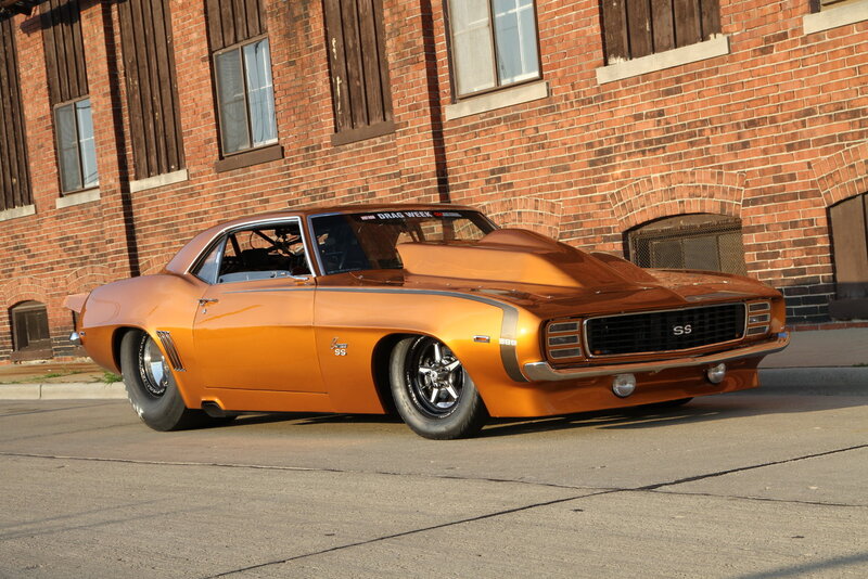 Orange Muscle Car — Dramatic, Afternoon, Photograph, Brick Building, Street