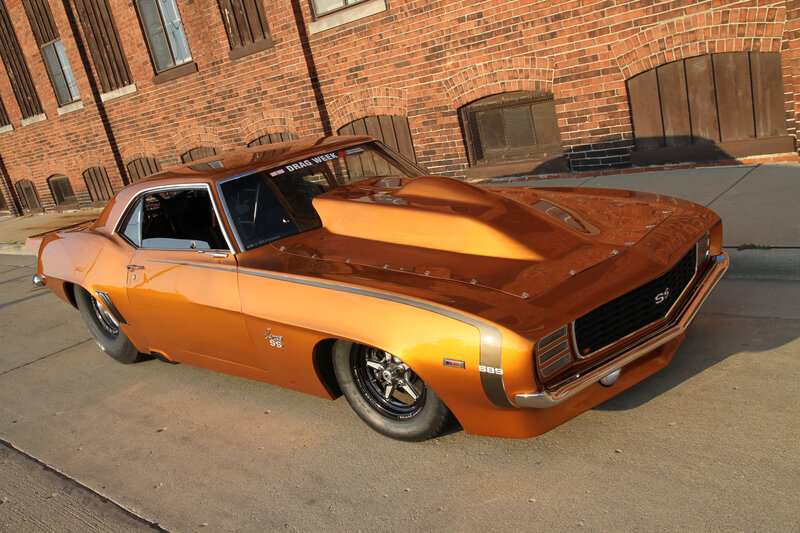 Orange Muscle Car — Dramatic, Afternoon, Photograph, Brick Building