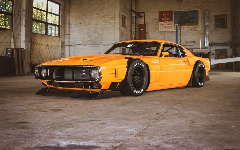 Orange Muscle Car — Dramatic, Afternoon, Photograph, Brick Wall