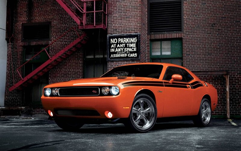 Orange Muscle Car — Dramatic, Photograph, Brick Building, Fire Escape
