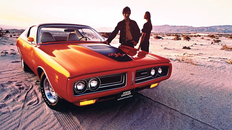 Orange Muscle Car — Dramatic, Sunset, Photograph, Man, Woman, Desert