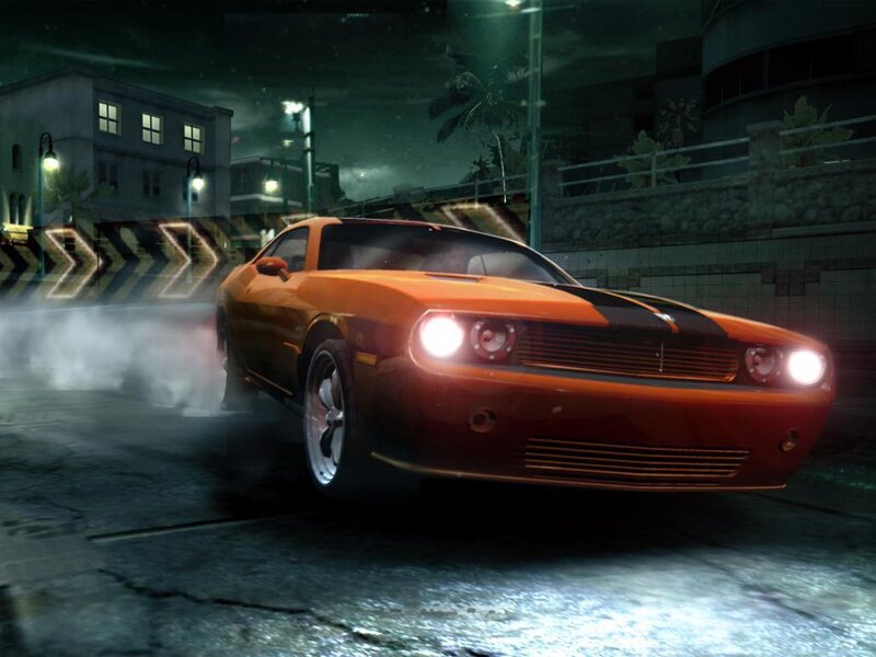 orange muscle car drifting at night
