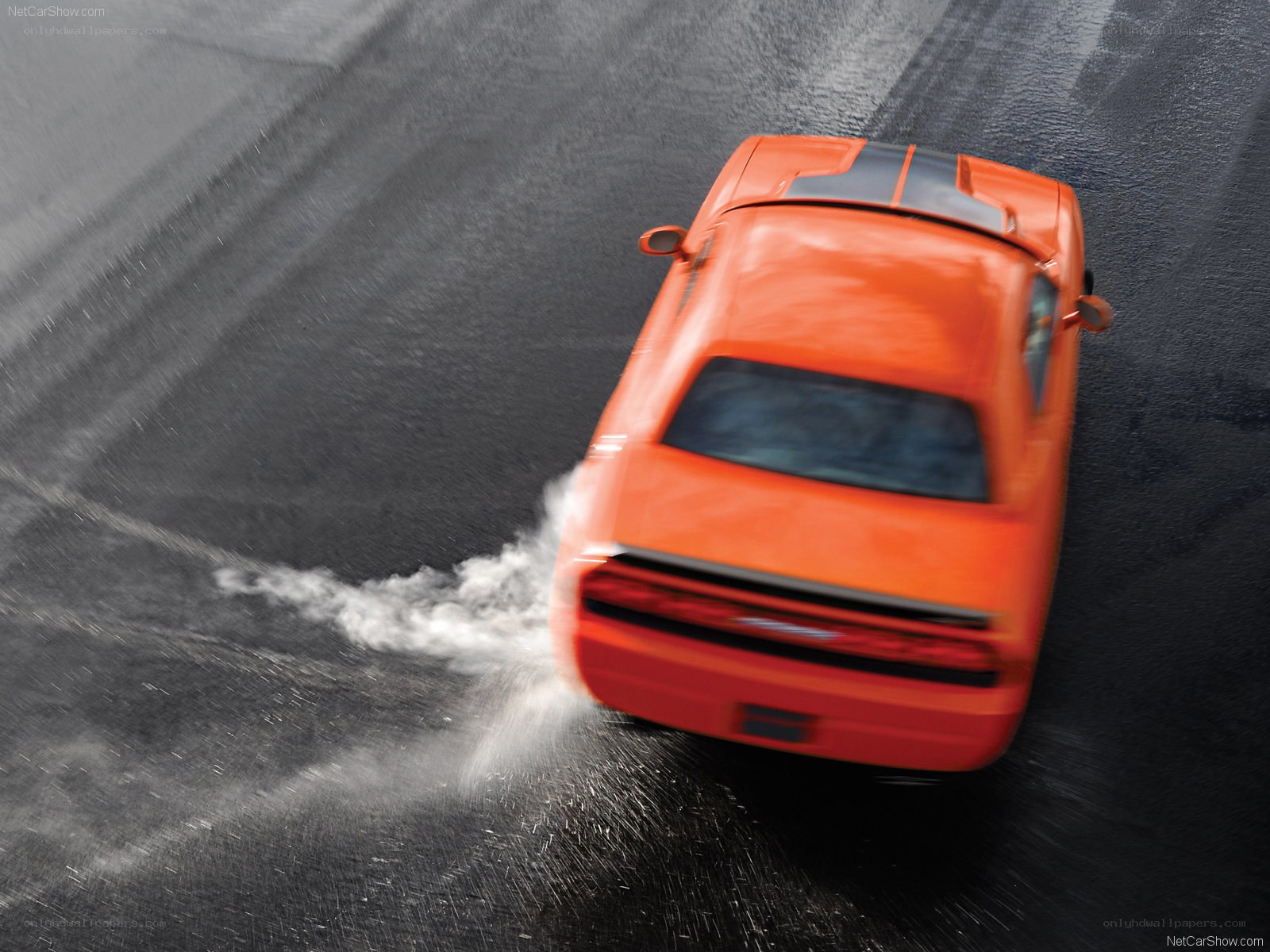 orange muscle car drifting