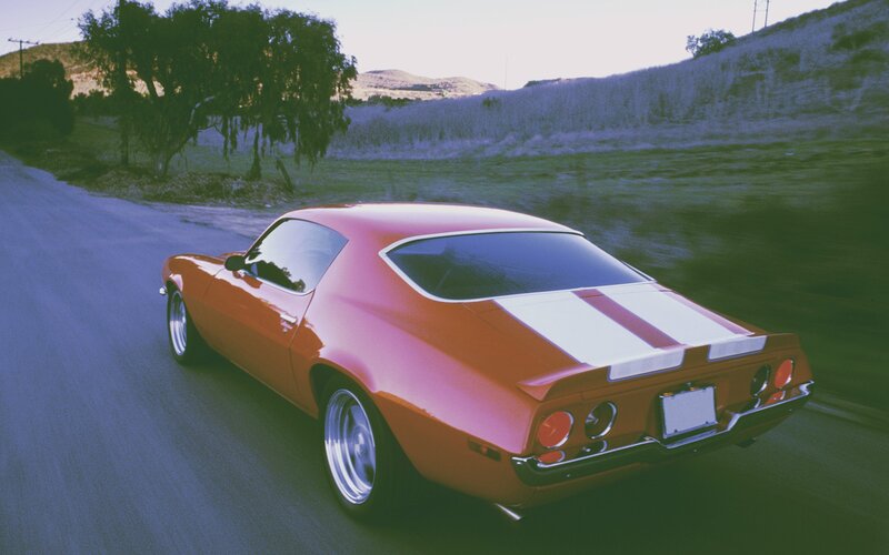 Orange Muscle Car — Dynamic, Afternoon, Photograph, Road, Trees, Hills