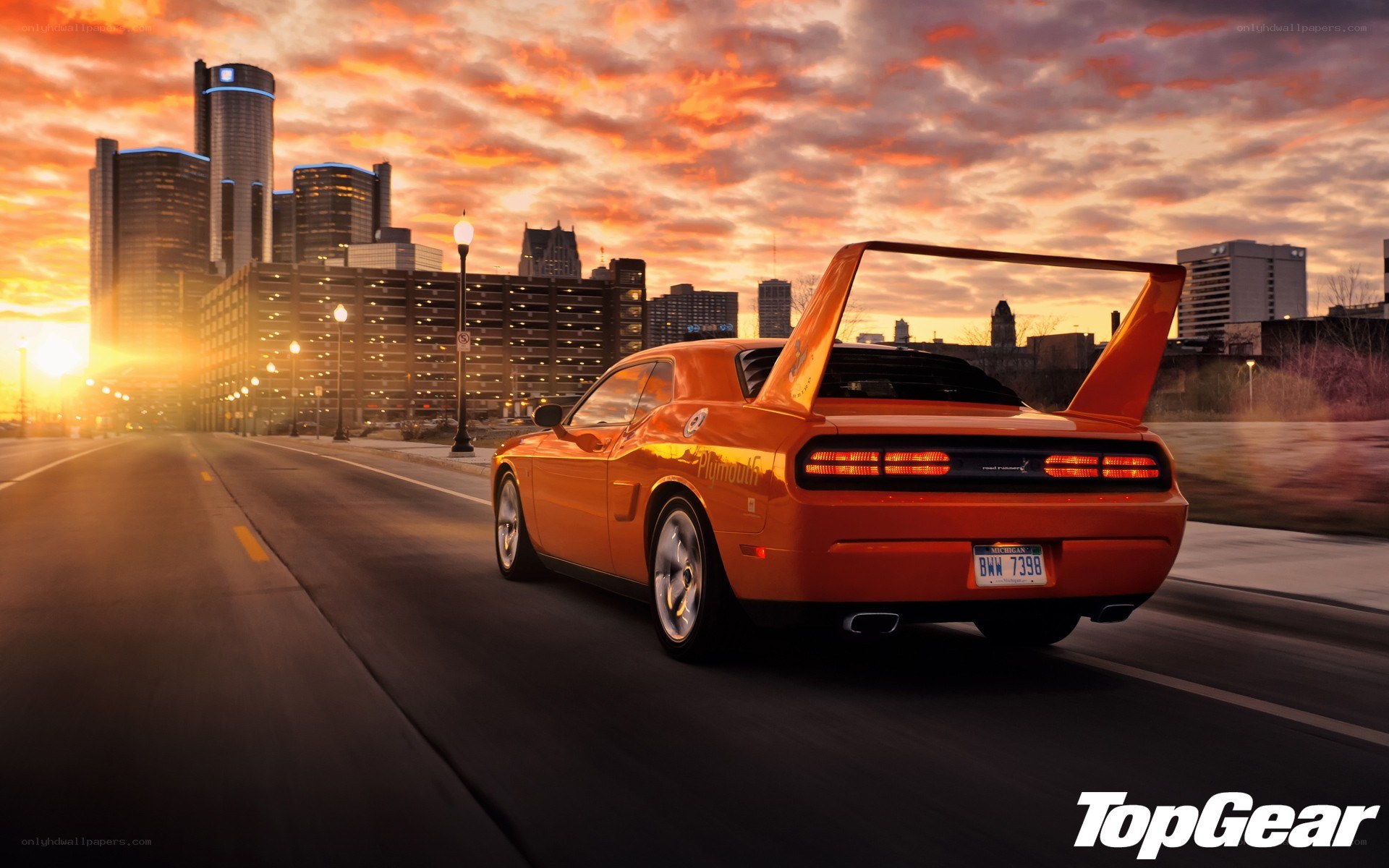 Orange muscle car in city