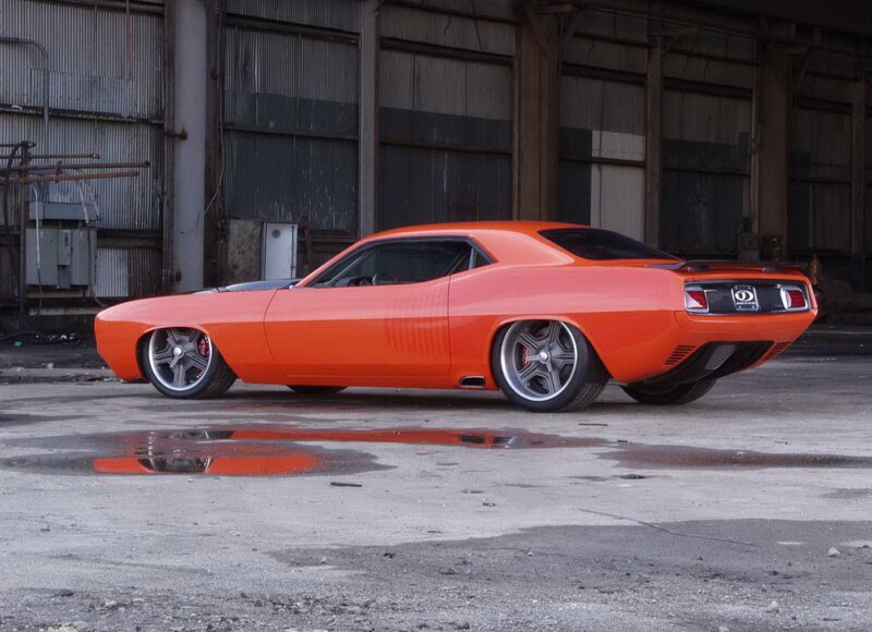 Orange muscle car in warehouse