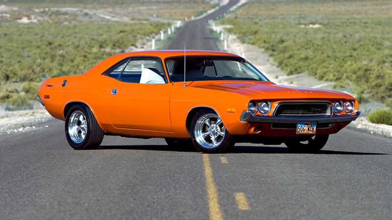 Orange muscle car on desert road