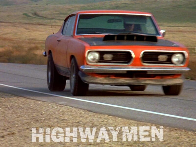 orange muscle car on highway