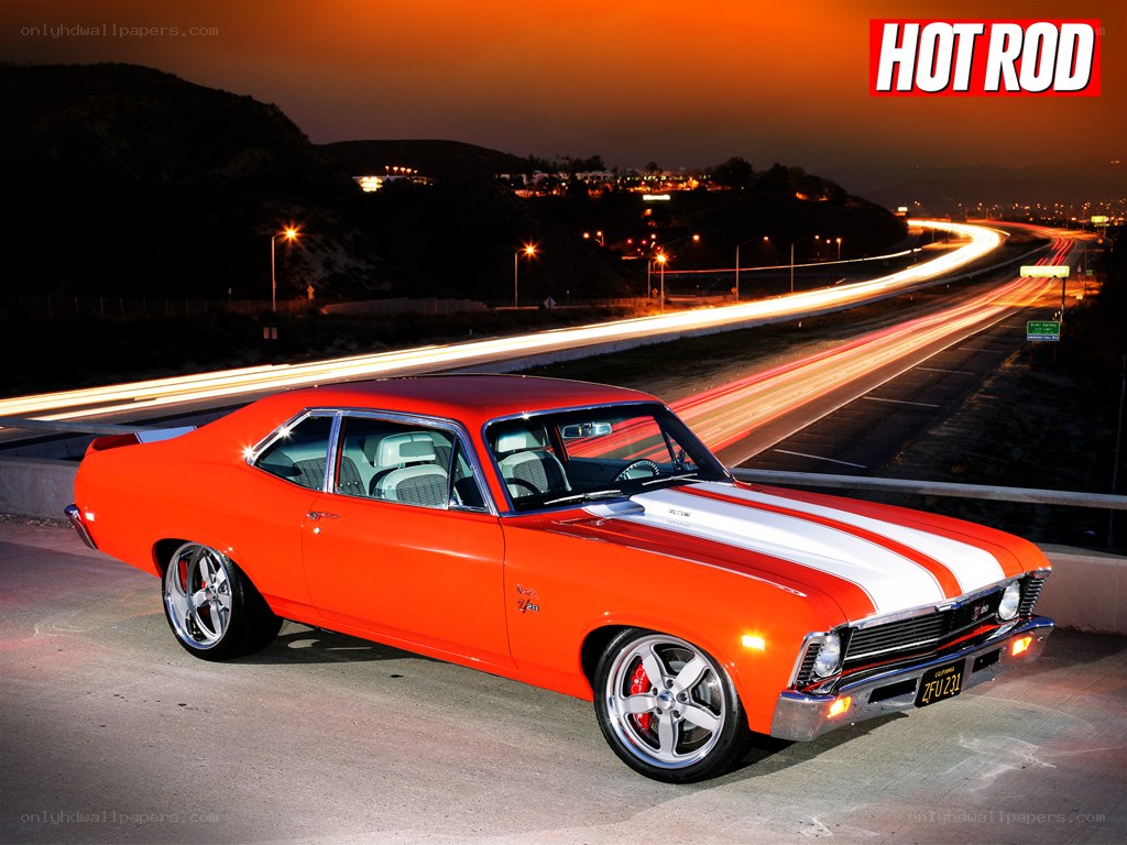 Orange muscle car on highway