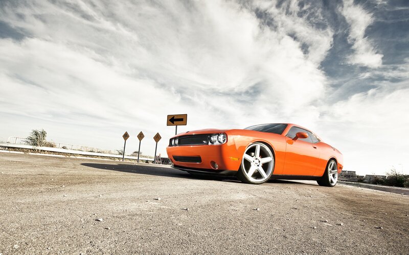 Orange muscle car on road