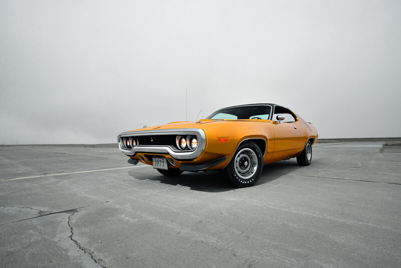 Orange muscle car on tarmac